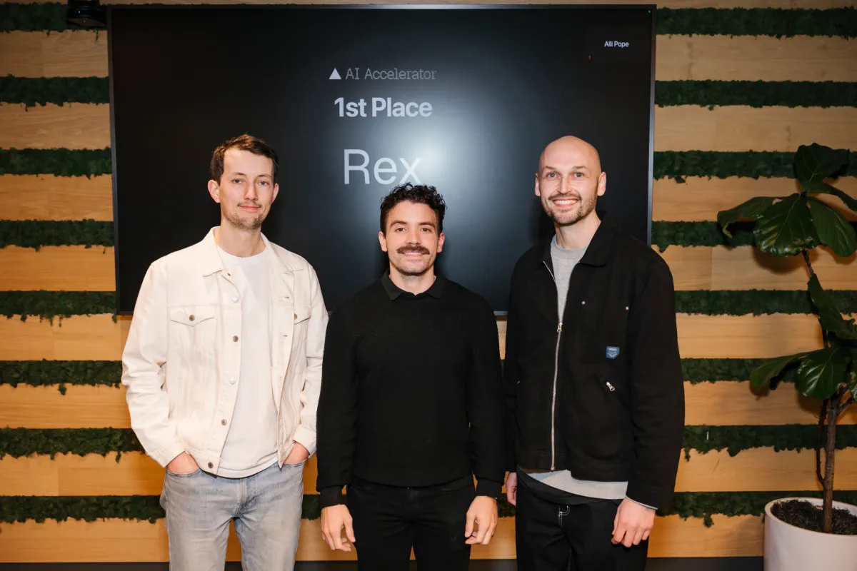 The Rex team in front of the AI Accelerator 1st Place screen